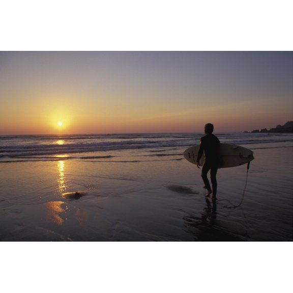 Posterazzi DPI1878756 Silhouetted Surfer On Sandy Beach At Sunset Poster Print, 18 x 11