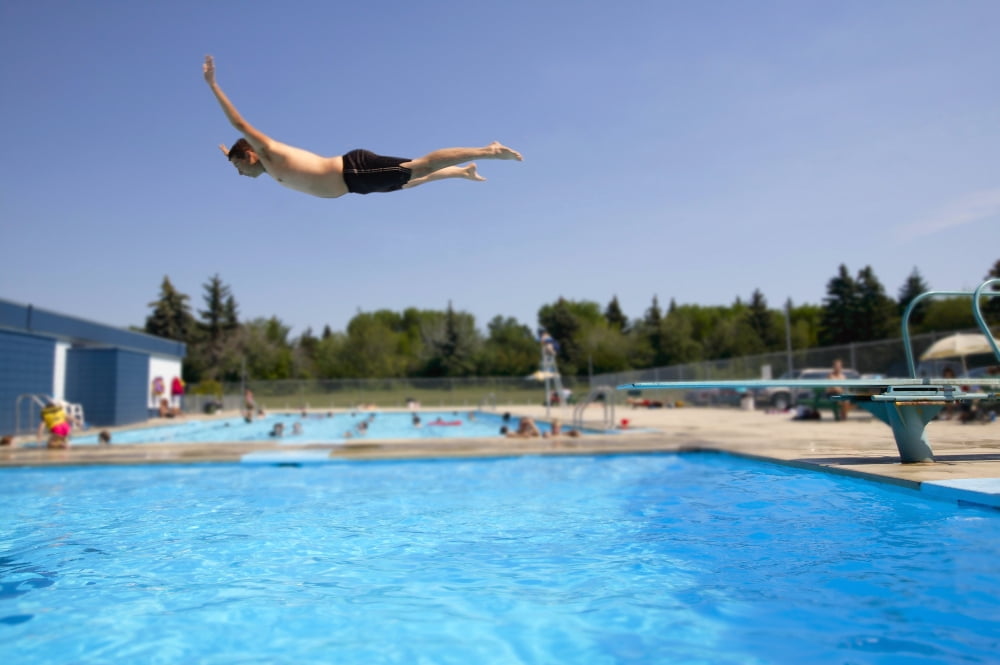 Posterazzi Diving Into A Pool Canvas Art - Don Hammond Design Pics (34 x 22)