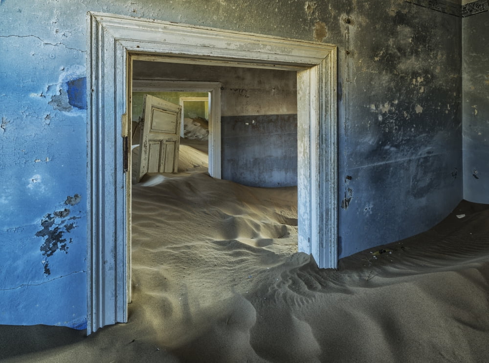 Posterazzi Drifting sand fills the rooms of a colourful abandoned house Kolmanskop Namibia Canvas Art - Robert Postma Design Pics (36 x 26)