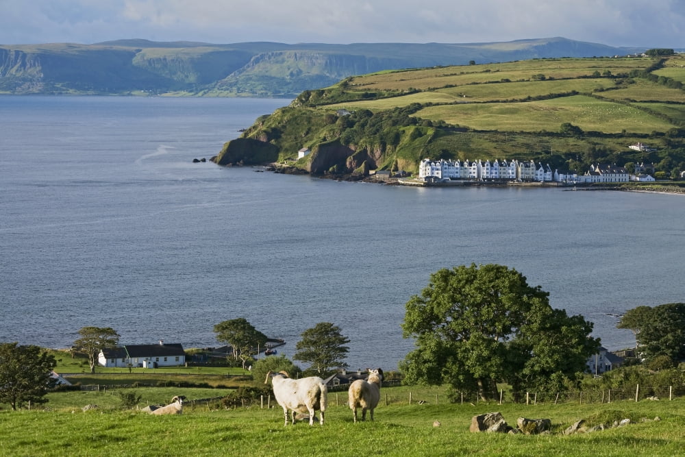 Posterazzi Farmland and bay at Cushendum Glens of Antrim County Antrim Ireland Canvas Art - Carl Bruemmer Design Pics (38 x 24)