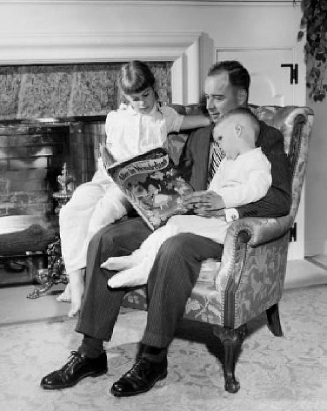 Posterazzi Father reading Alice in Wonderland to daughter and son Canvas Art - (24 x 36)