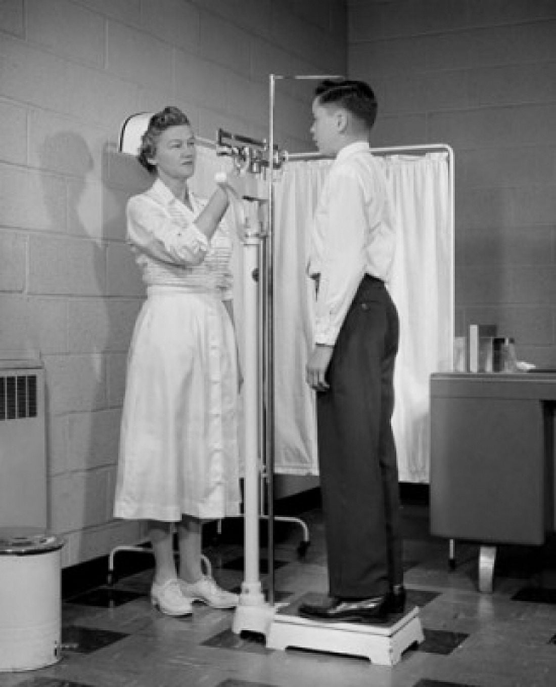 Posterazzi Female nurse measuring height and weight of a boy Canvas Art - (24 x 36)