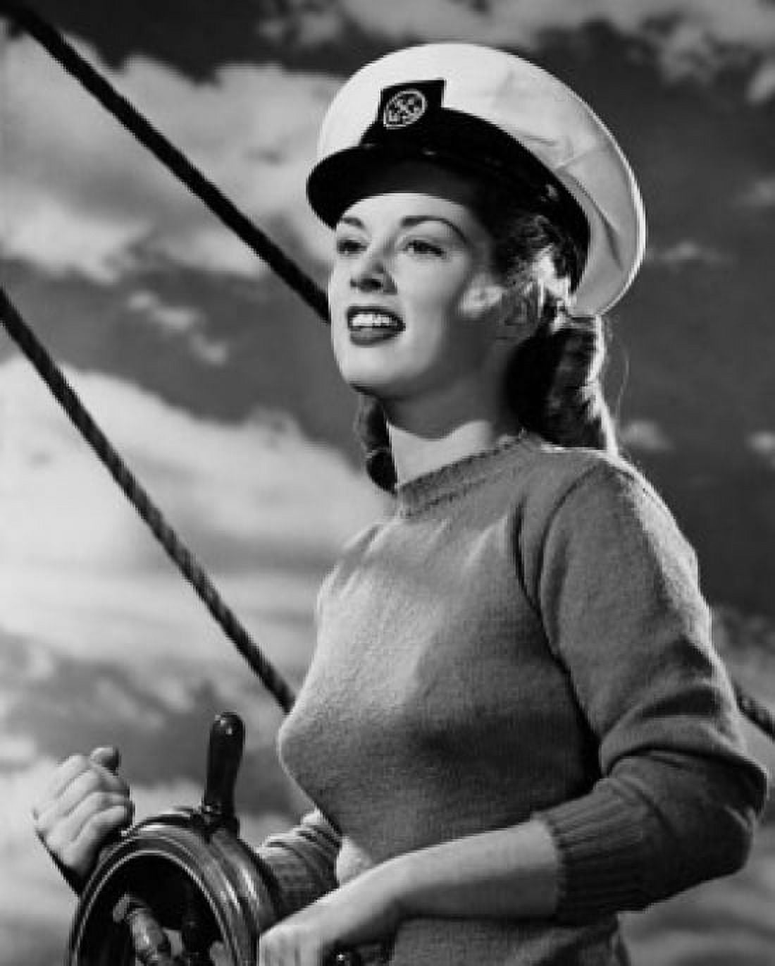 Posterazzi Female sailor steering boat and smiling Canvas Art -  (24 x 36)