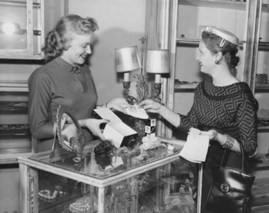Posterazzi Female sales clerk showing jewelry to a customer in a jewelry store Canvas Art -  (24 x 36)