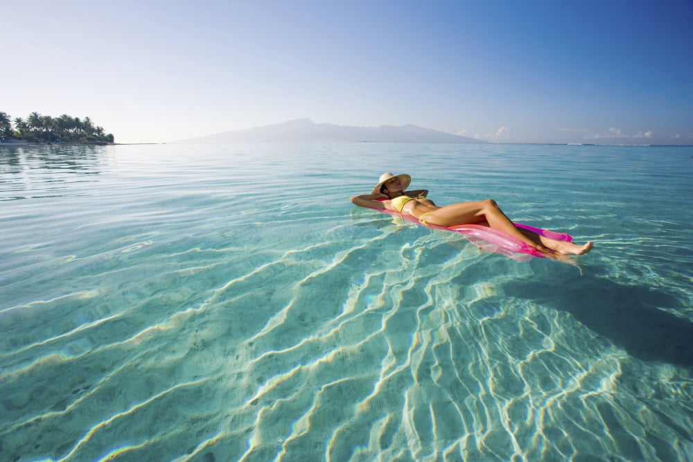 Posterazzi French Polynesia Tahiti Moorea Woman Floating In Water Canvas Art - M Swiet Productions Design Pics (38 x 24)
