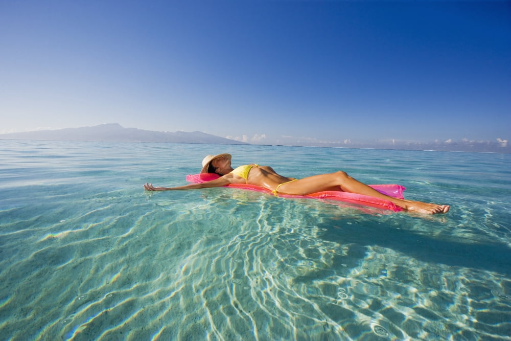 Posterazzi French Polynesia Tahiti Moorea Woman Floating In Water Canvas Art - M Swiet Productions Design Pics (38 x 24)