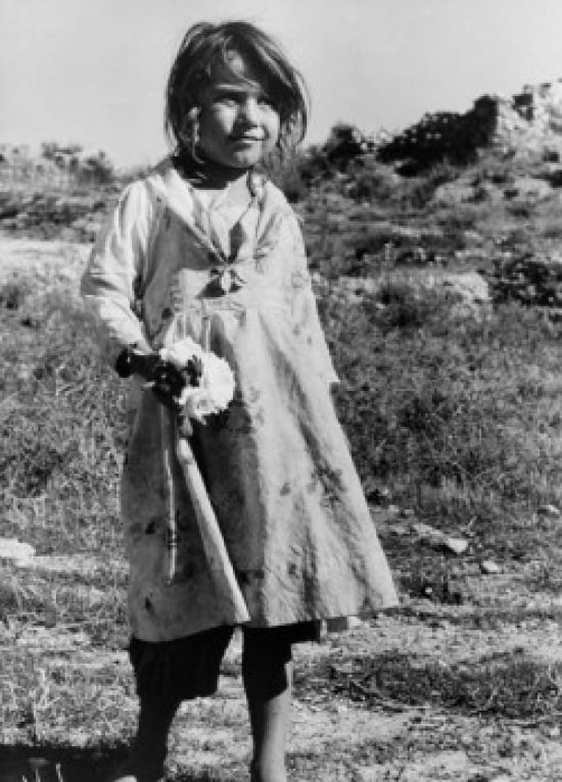 Posterazzi Girl in shaggy clothes standing in field Canvas Art -  (24 x 36)