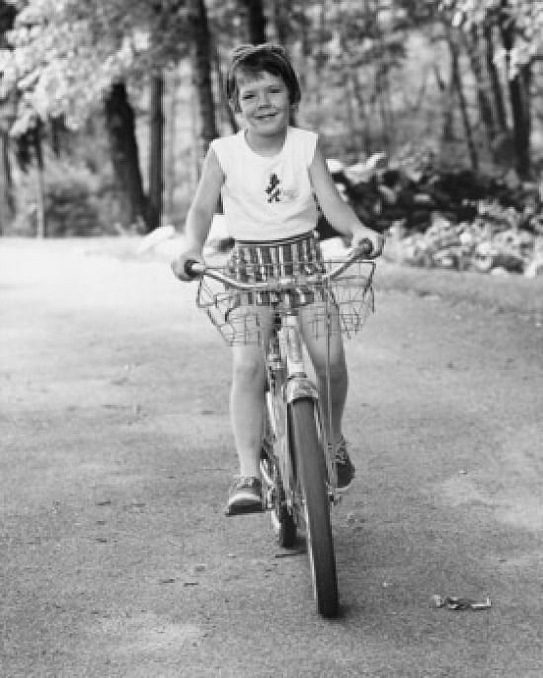 Posterazzi Girl riding a bicycle Canvas Art -  (24 x 36)