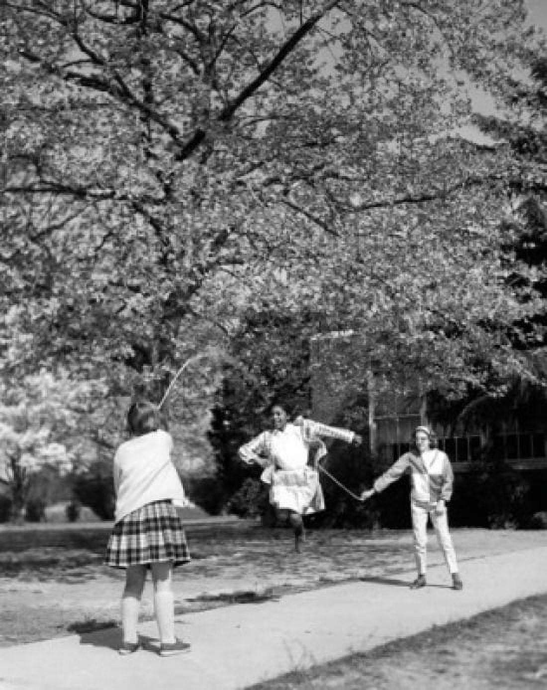 Posterazzi Girls playing with jump rope in the park Canvas Art - (24 x 36)