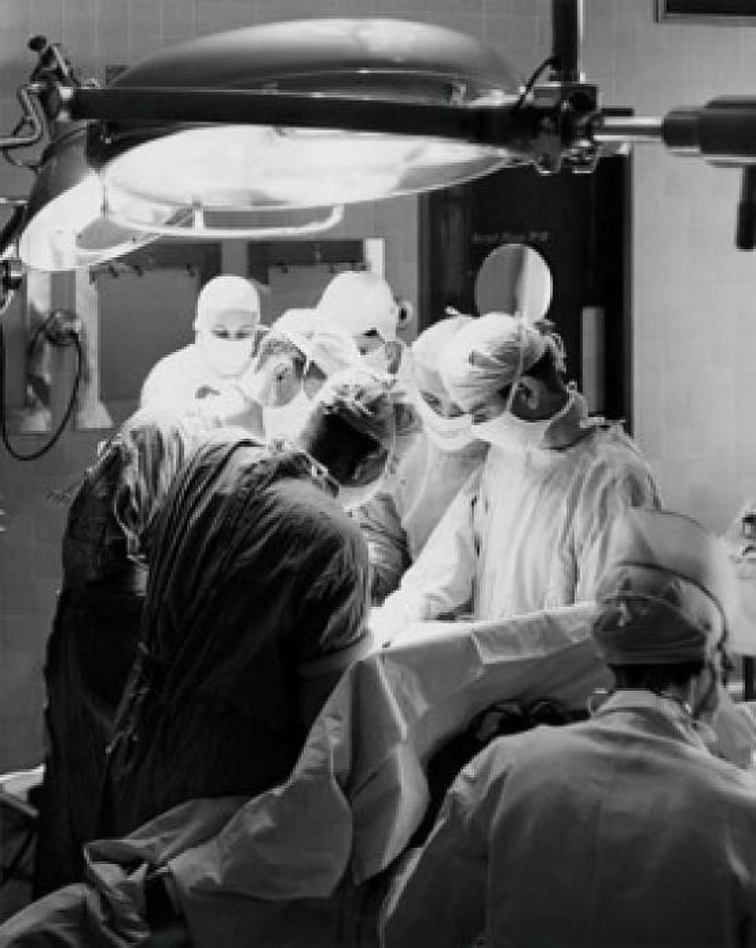 Posterazzi Group of surgeons performing an operation in an operating room Canvas Art -  (24 x 36)