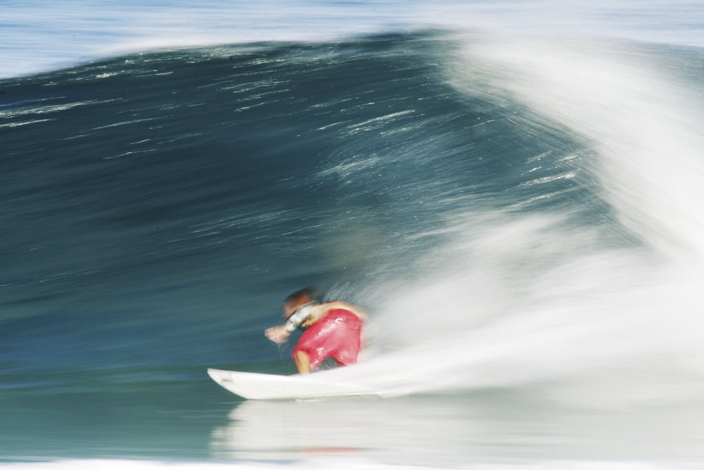 Posterazzi Hawaii Oahu North Shore Surfer Riding Blur Canvas Art - Vince Cavataio Design Pics (34 x 22)