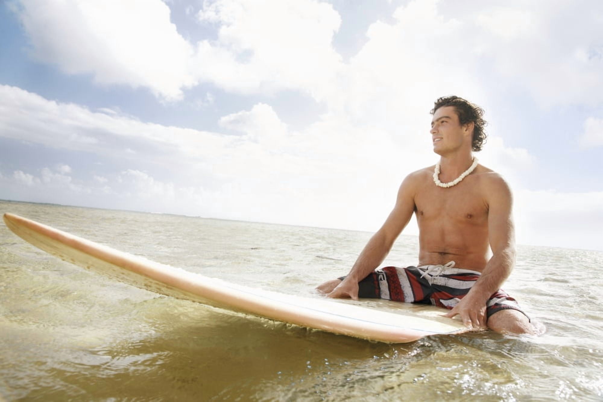 Posterazzi Hawaii Oahu Young Man Sitting On His Surfboard At The Shoreline Canvas Art - Brandon Tabiolo Design Pics (34 x 22)