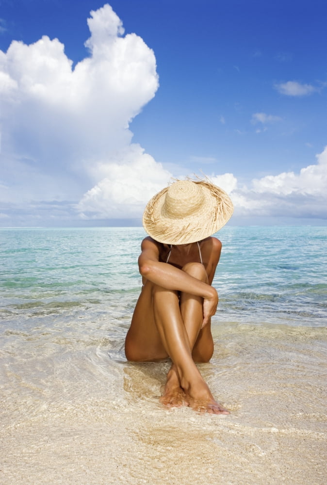 Posterazzi Hawaii Woman Sitting In The Ocean At A Remote Tropical Location Canvas Art - M Swiet Productions Design Pics (22 x 34)