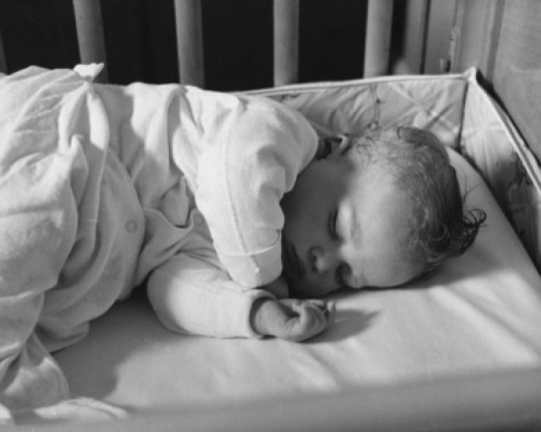 Posterazzi High angle view of a baby sleeping in a crib Canvas Art - (24 x 36)