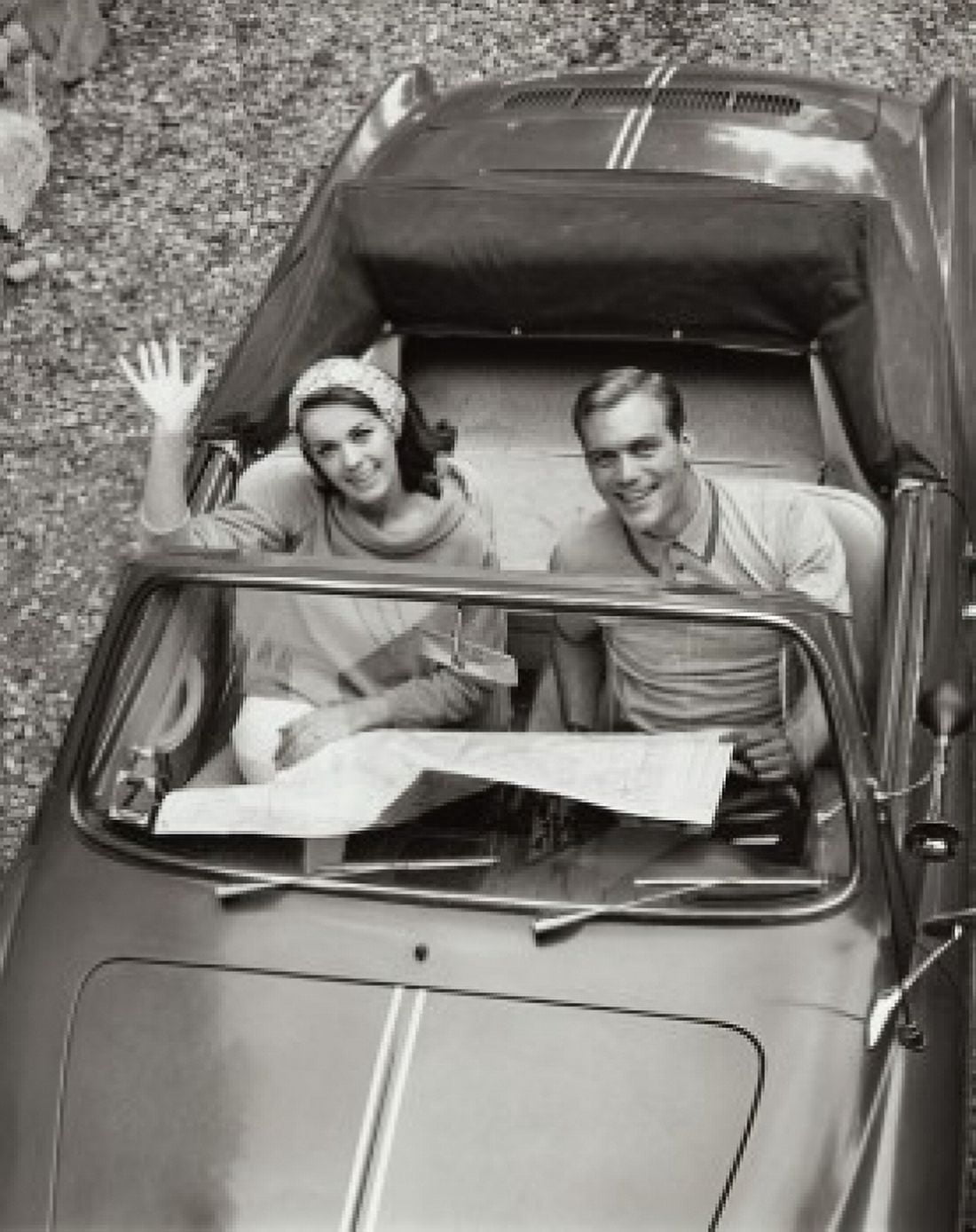Posterazzi High angle view of a young couple sitting in a convertible car Canvas Art - (24 x 36)