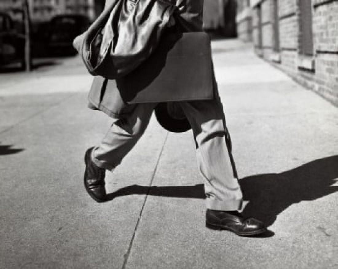 Posterazzi Legs of a businessman walking with a briefcase Canvas Art -  (24 x 36)