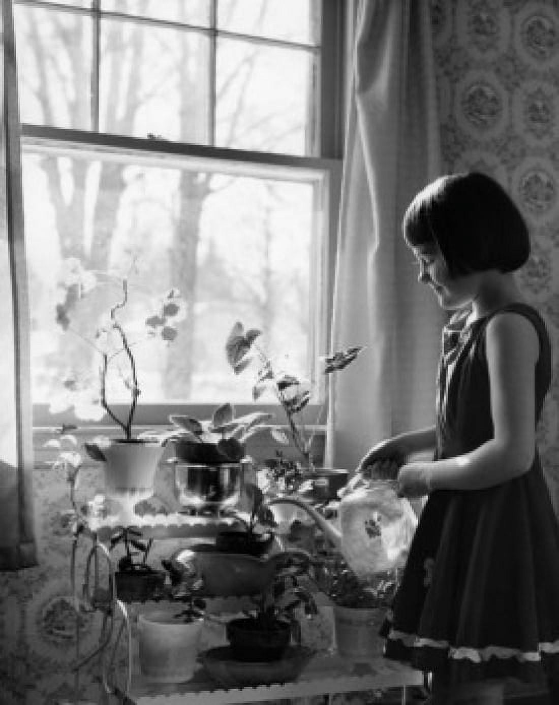 Posterazzi Little girl watering house plants Canvas Art - (24 x 36)