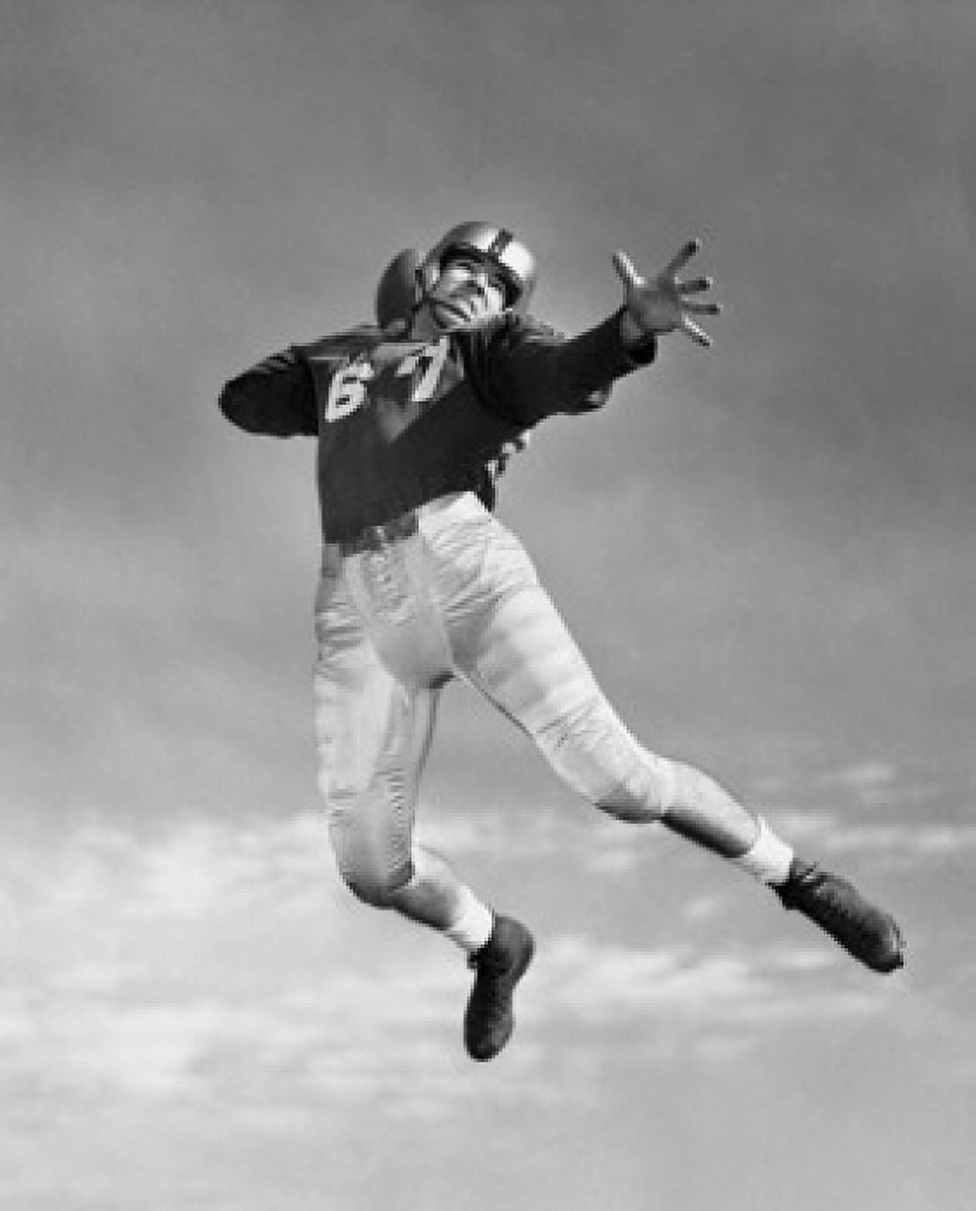 Posterazzi Low angle view of a football player throwing a football Canvas Art - (24 x 36)