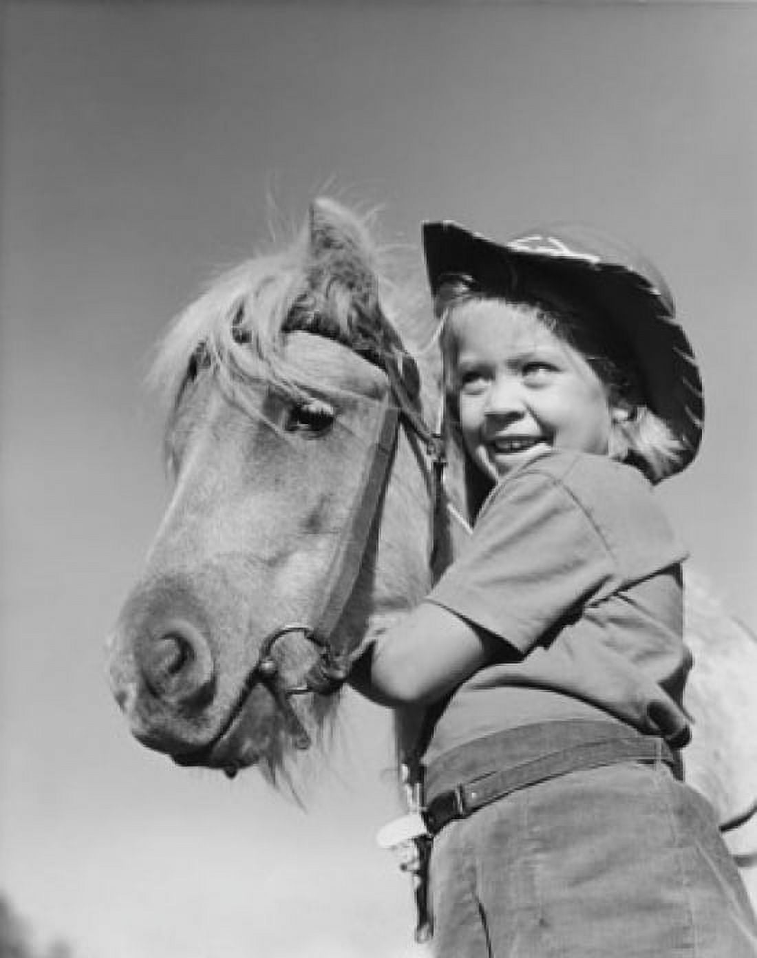 Posterazzi Low angle view of a girl standing with a horse and smiling Canvas Art - (24 x 36)