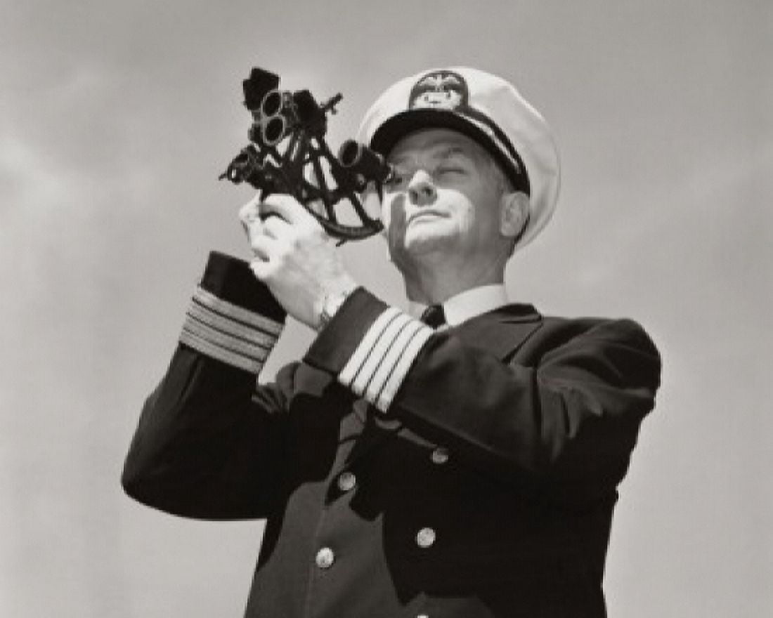 Posterazzi Low angle view of a ship captain looking through a sextant Canvas Art - (24 x 36)