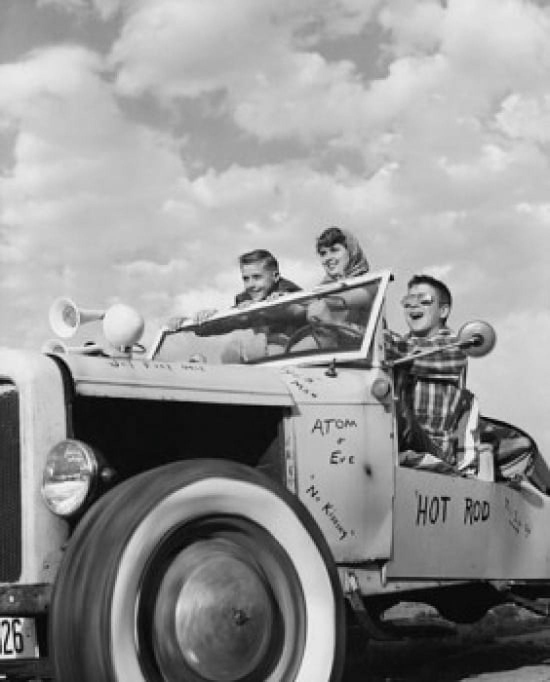 Posterazzi Low angle view of teenagers sitting in a vintage car Canvas Art - (24 x 36)