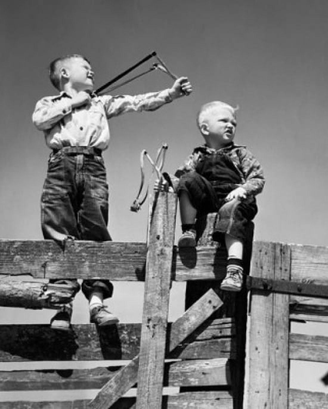 Posterazzi Low angle view of two boys holding slingshots Canvas Art -  (24 x 36)