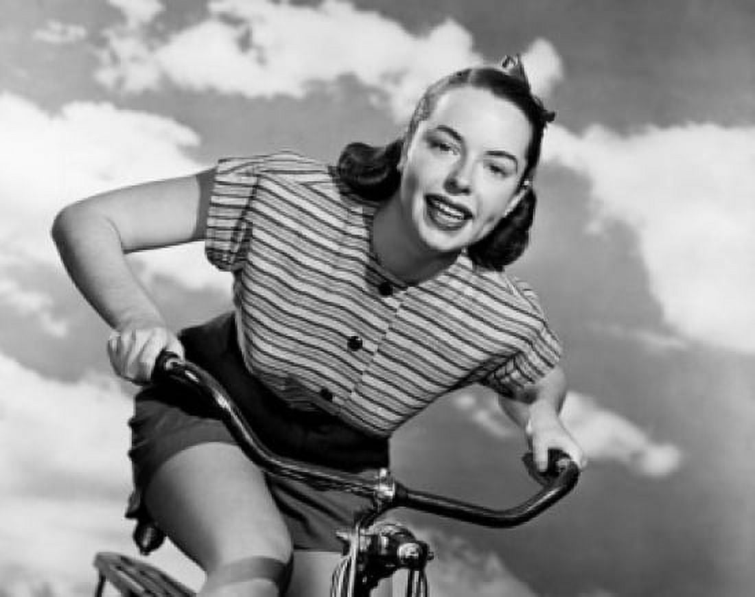 Posterazzi Low angle view of young woman cycling Canvas Art - (24 x 36)