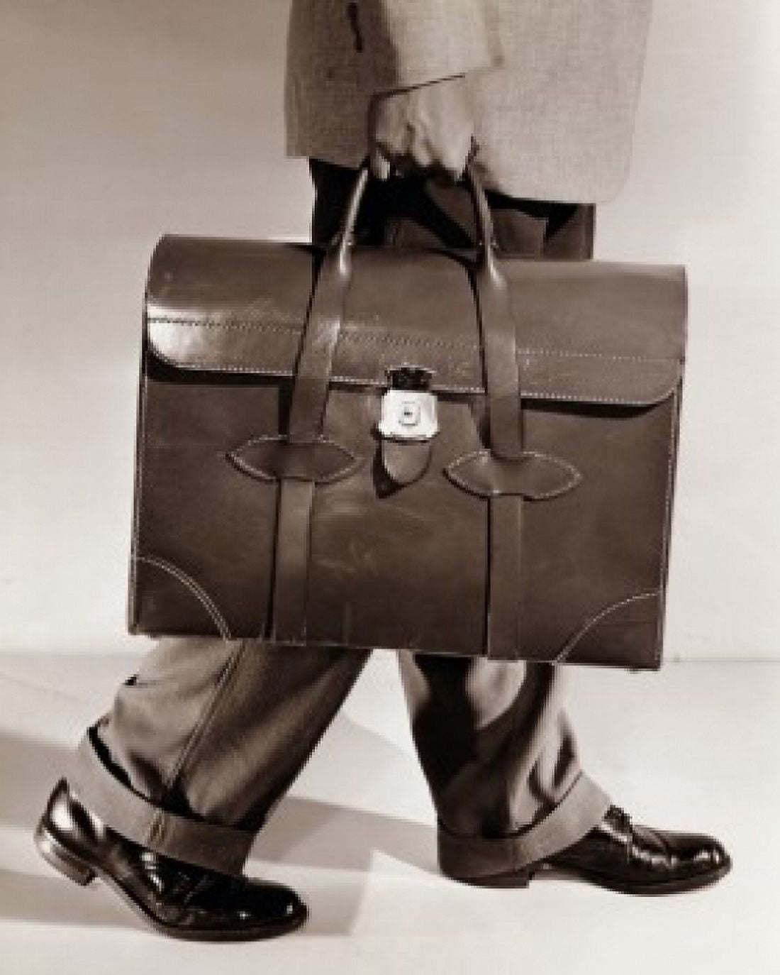 Posterazzi Low section view of a businessman carrying a briefcase Canvas Art - (24 x 36)