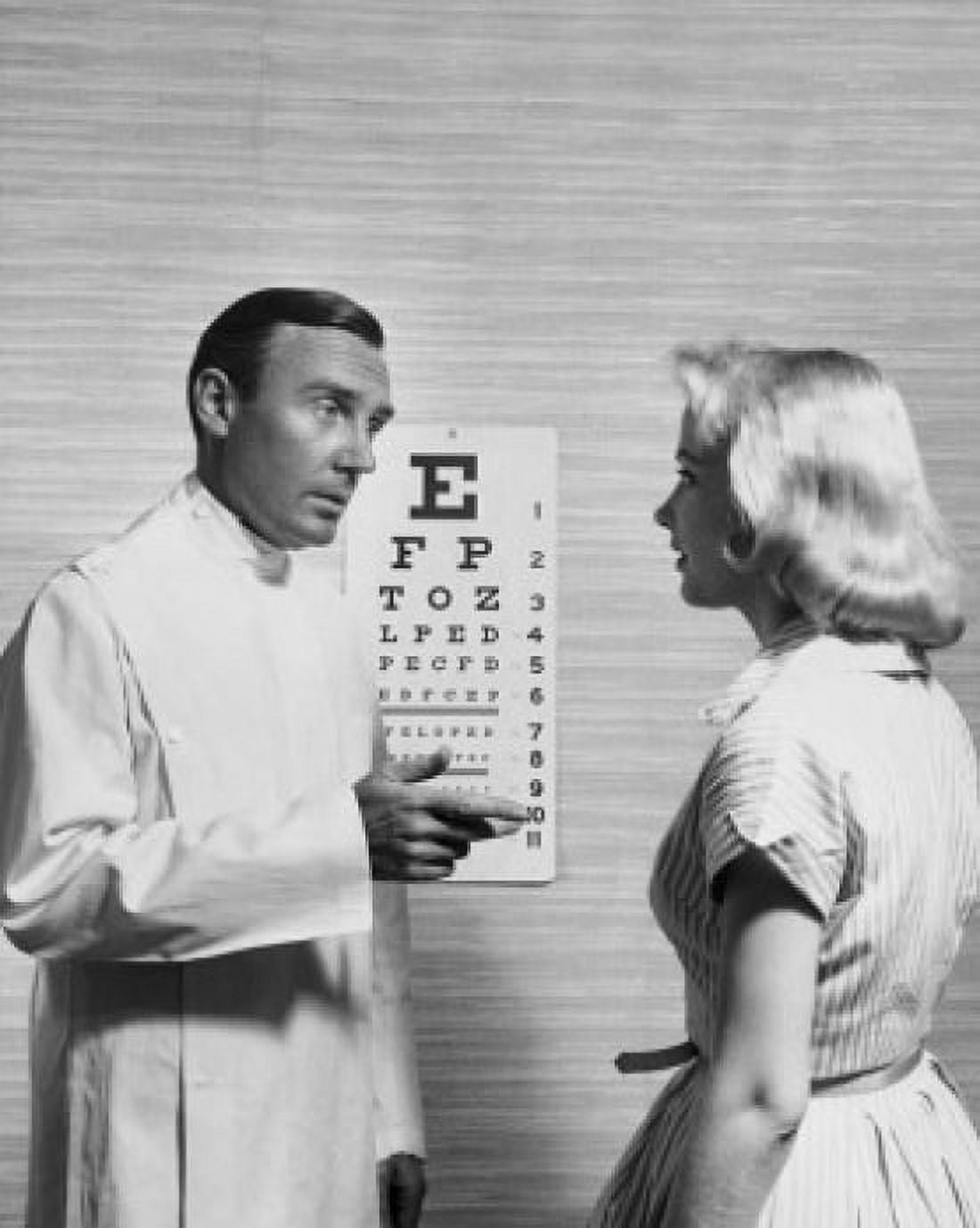 Posterazzi Male optometrist talking to a patient Canvas Art - (24 x 36)