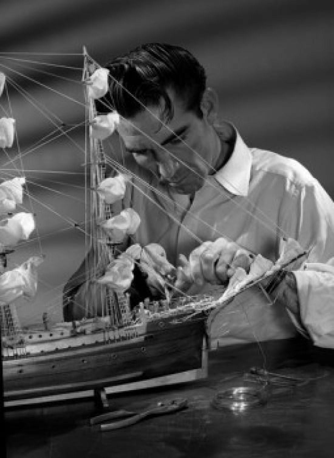 Posterazzi Man building model ship Canvas Art - (24 x 36)