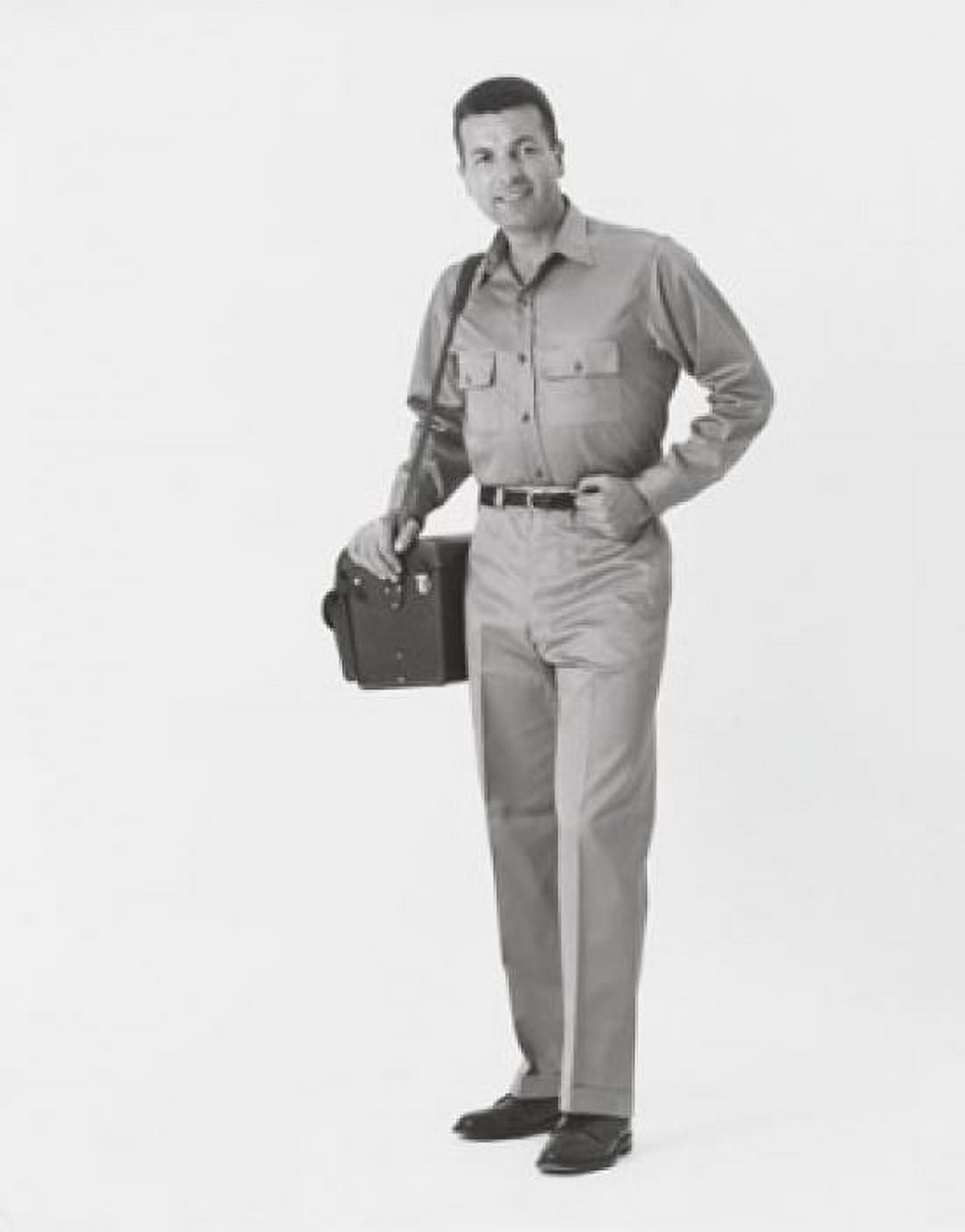 Posterazzi Man carrying a bag and smiling Canvas Art - (24 x 36)