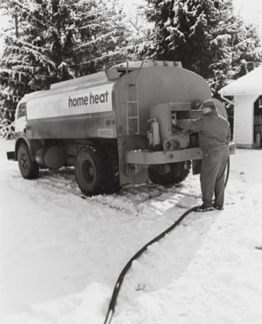 Posterazzi Man standing near a fuel tanker Canvas Art - (24 x 36)