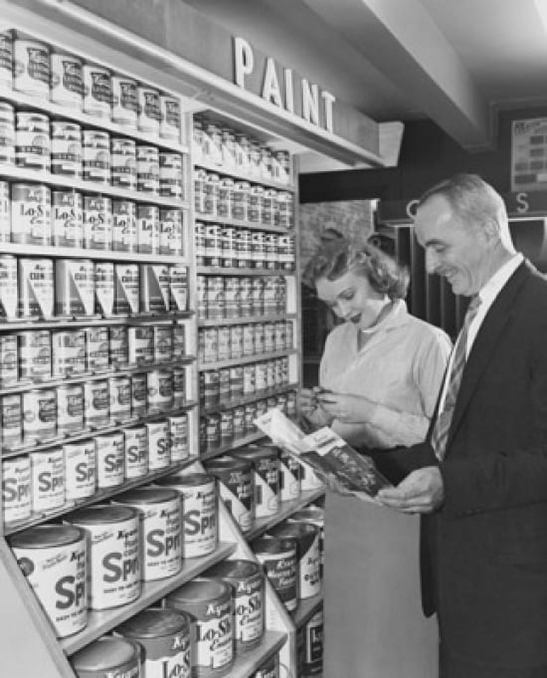 Posterazzi Mature couple standing in a paint store Canvas Art - (24 x 36)