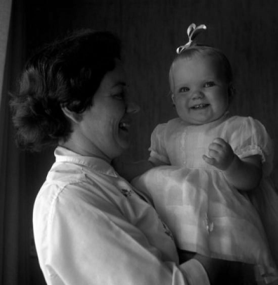 Posterazzi Mature woman holding baby girl Canvas Art -  (24 x 36)