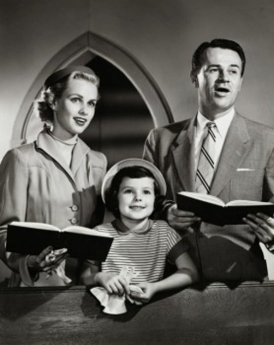 Posterazzi Mid adult couple and their daughter praying in church Canvas Art -  (24 x 36)