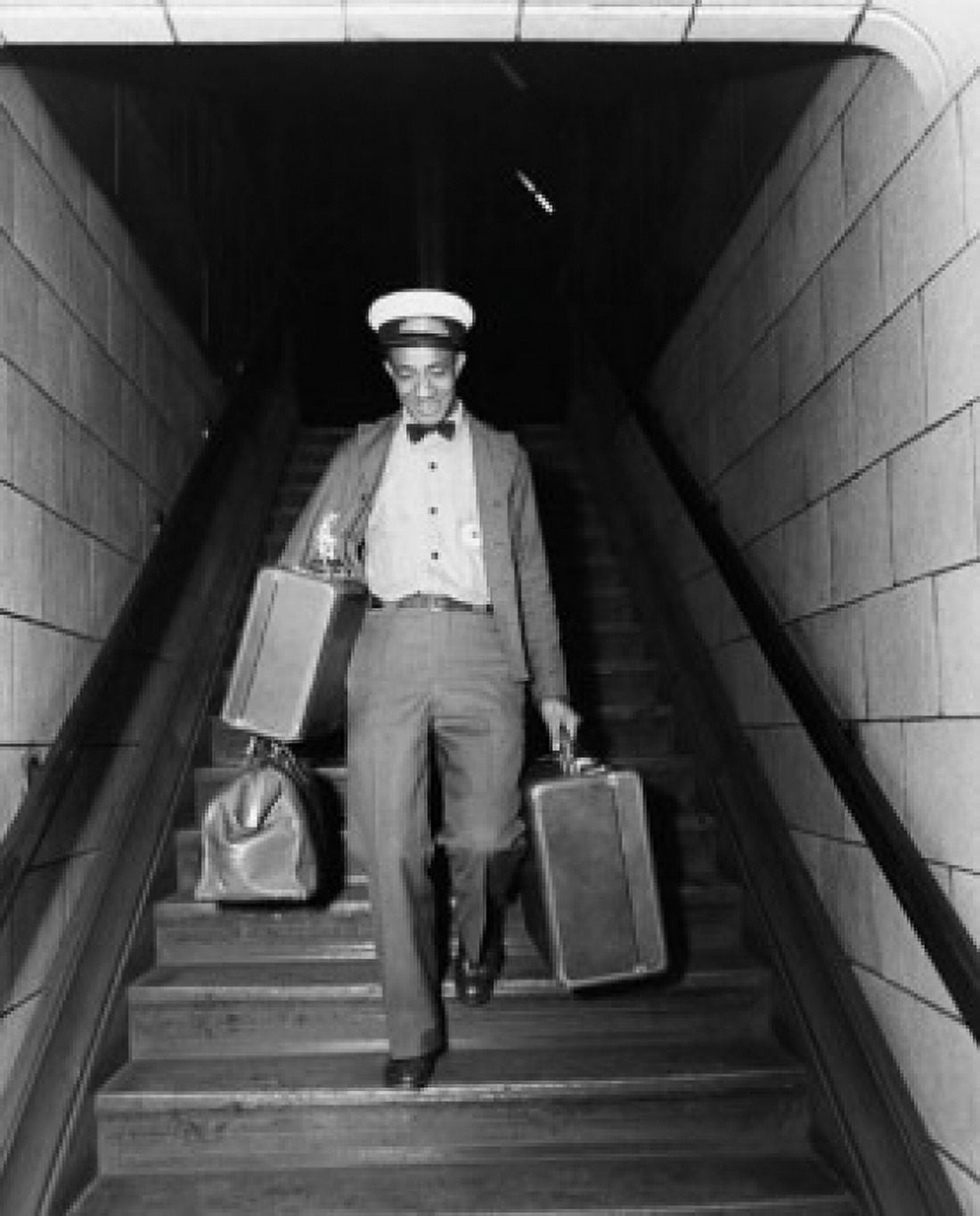 Posterazzi Mid adult man moving down a staircase with luggage Canvas Art -  (24 x 36)