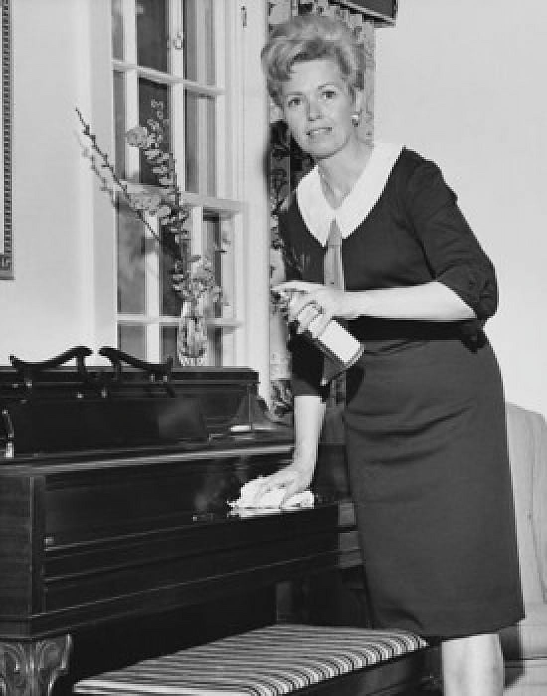 Posterazzi Mid adult woman cleaning the piano Canvas Art - (24 x 36)