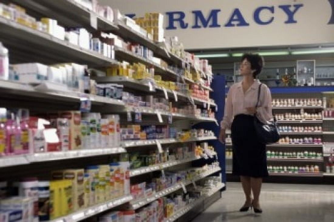 Posterazzi Mid adult woman looking at medicines in a pharmacy Canvas Art - (24 x 36)