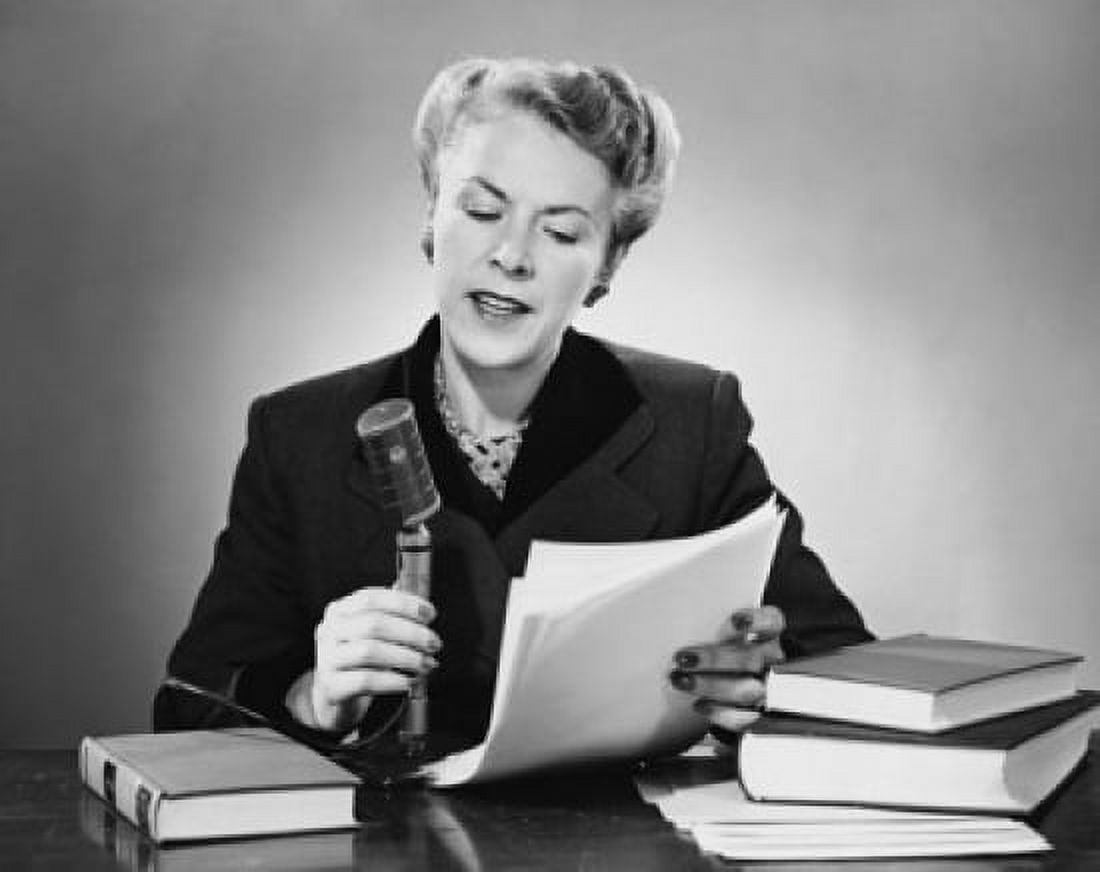 Posterazzi Mid adult woman reading a report into a microphone Canvas Art -  (24 x 36)