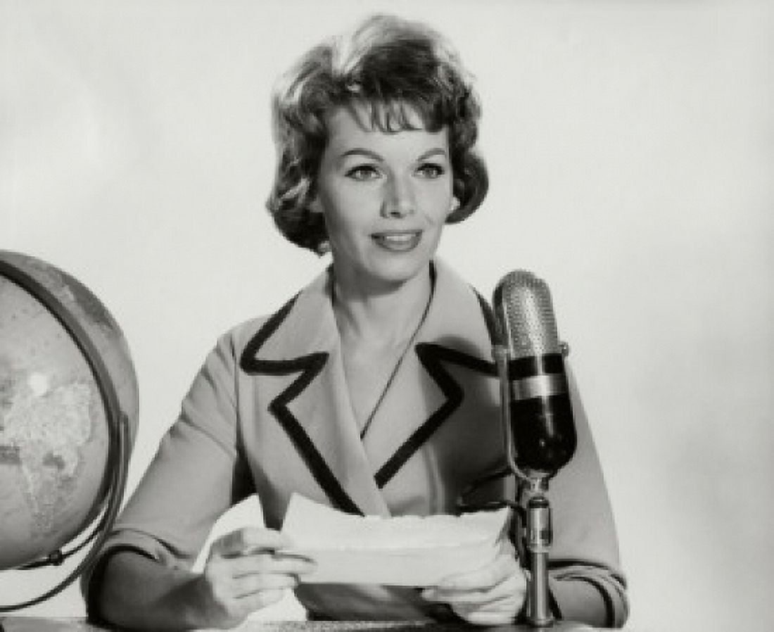 Posterazzi Mid adult woman reading a report into a microphone Canvas Art - (24 x 36)