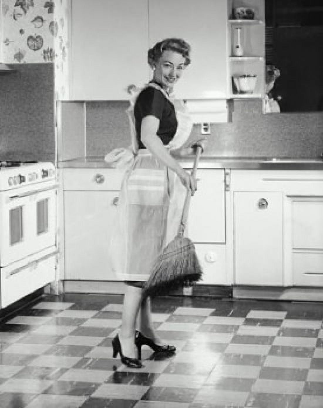 Posterazzi Mid adult woman sweeping kitchen floor Canvas Art - (24 x 36)