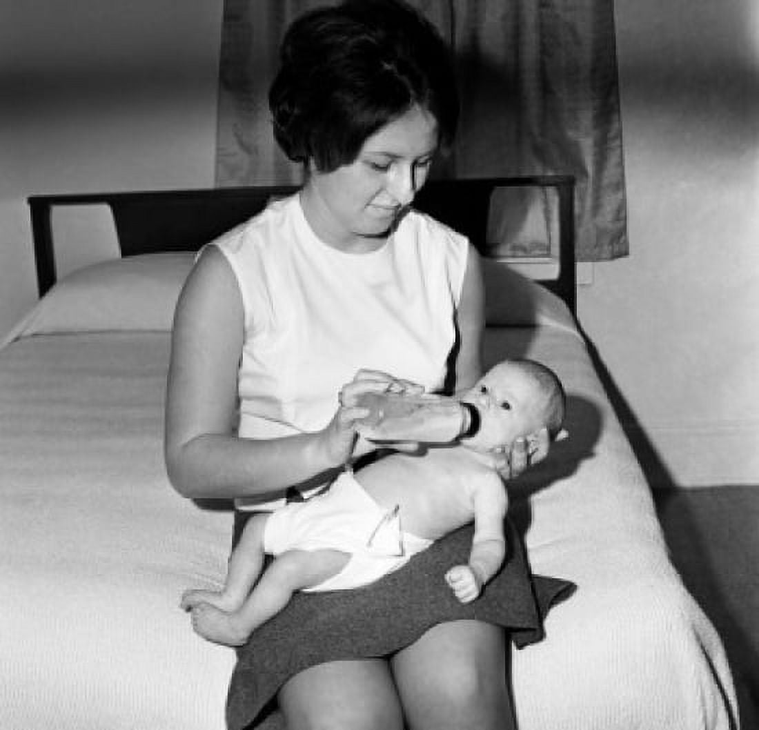 Posterazzi Mother feeding baby with bottle Canvas Art - (24 x 36)