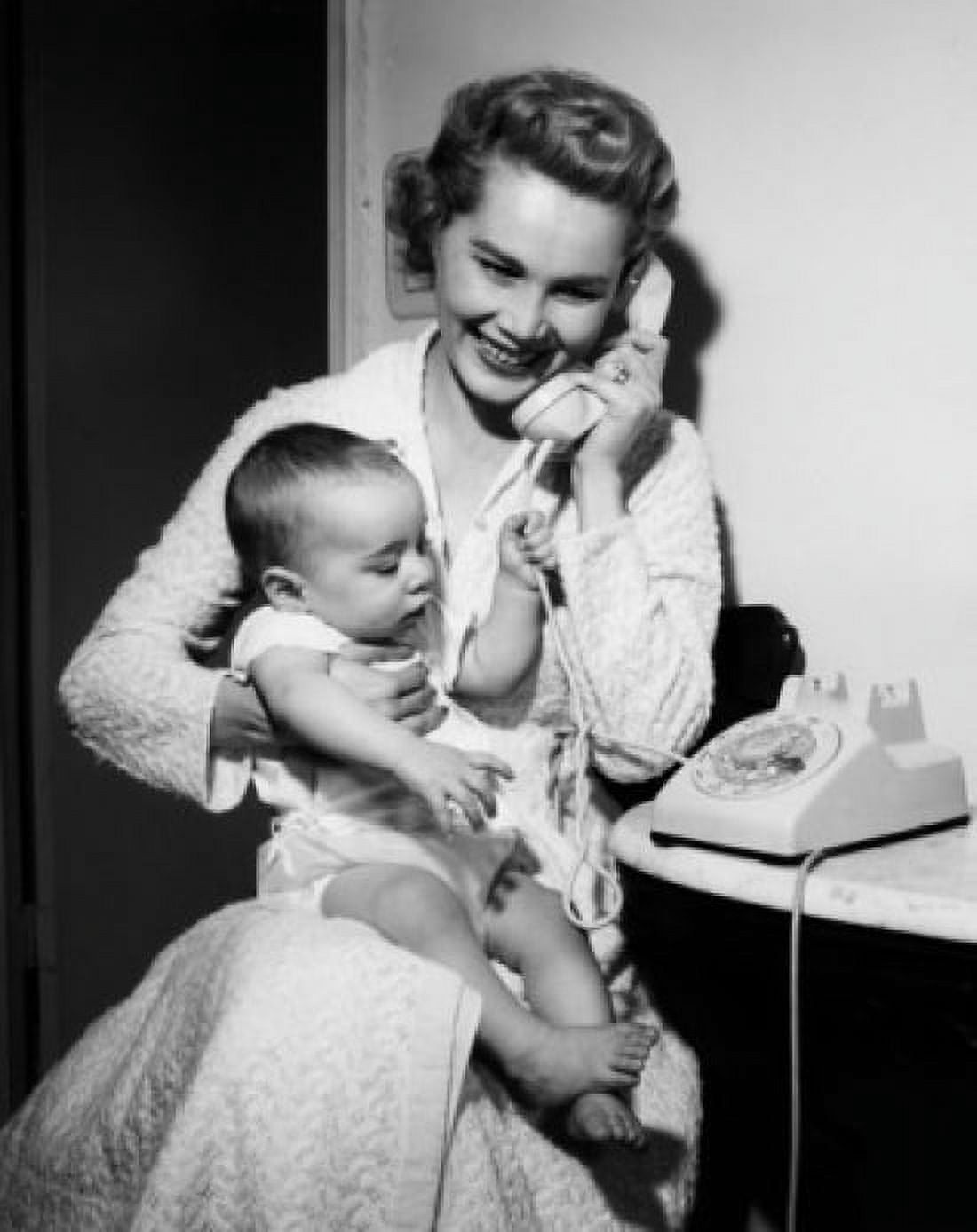 Posterazzi Mother with baby boy on laps talking on phone Canvas Art - (24 x 36)