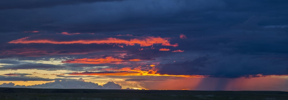 Posterazzi Panoramic vew of sunset lit clouds and a rain shower over Grasslands National Park Saskatchewan Canada Canvas Art - Robert Postma Design Pics (36 x 14)