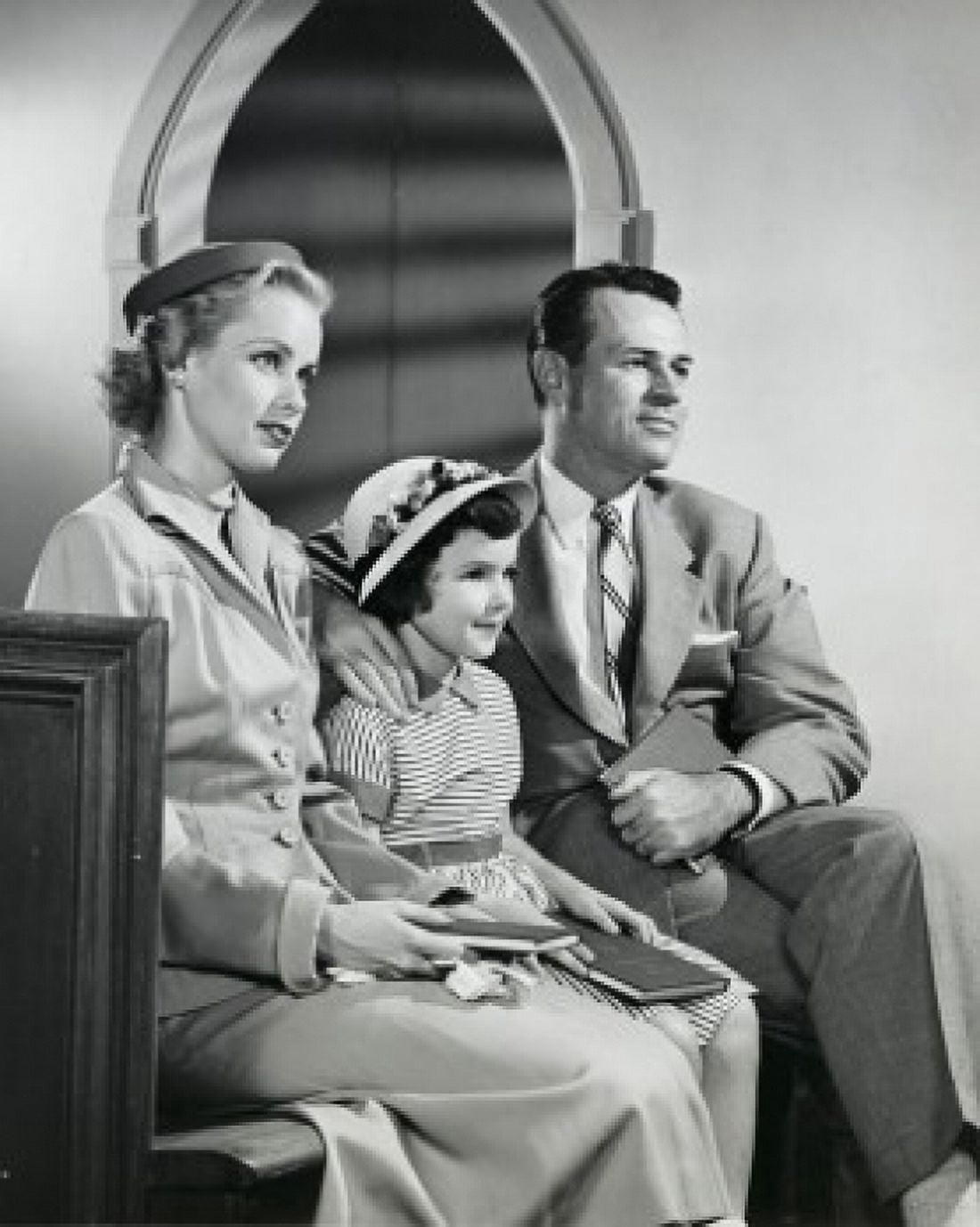 Posterazzi Parents and their daughter sitting in a church Canvas Art -  (24 x 36)
