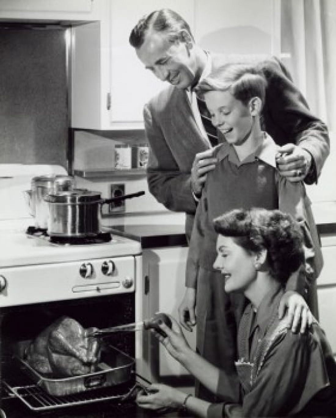 Posterazzi Parents and their son preparing a turkey in the kitchen Canvas Art - (24 x 36)