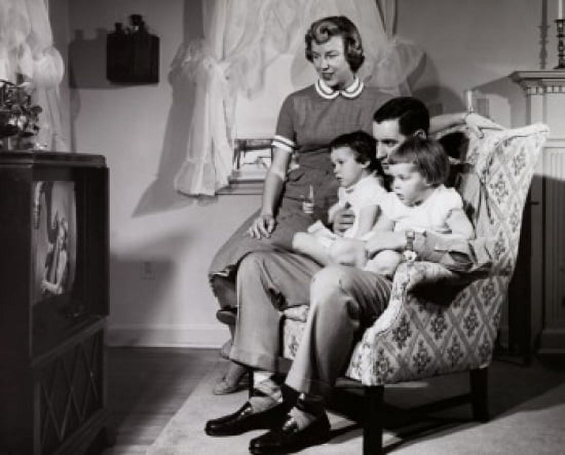 Posterazzi Parents with their two daughters watching television Canvas Art - (24 x 36)