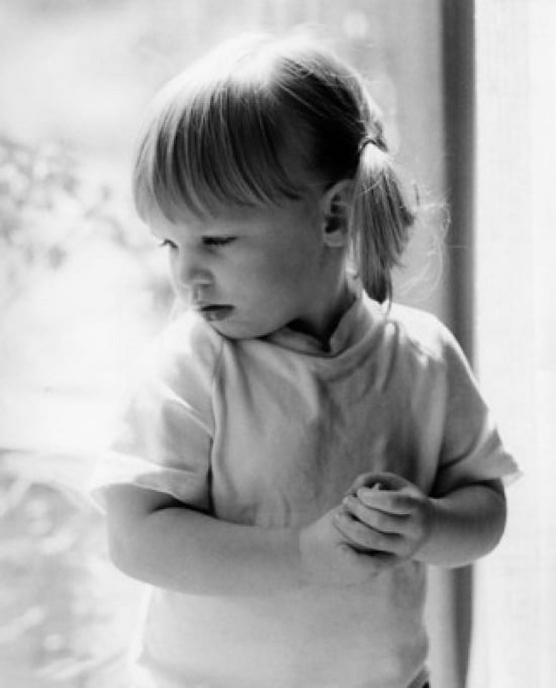 Posterazzi Pensive girl standing by window Canvas Art - (24 x 36)