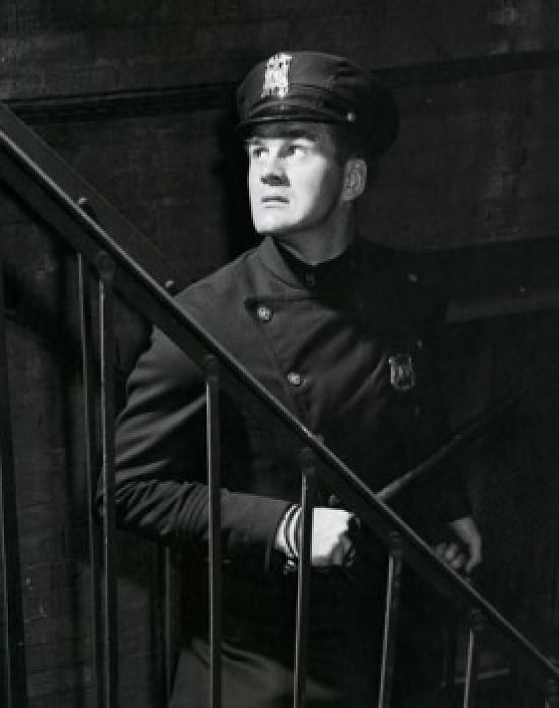 Posterazzi Policeman standing near a staircase Canvas Art - (24 x 36)