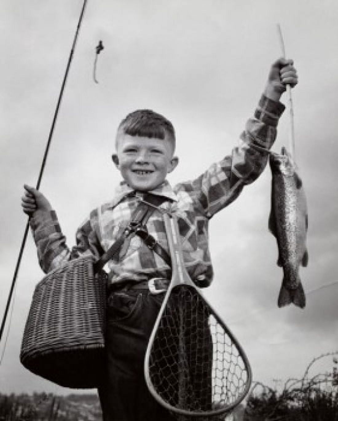 Posterazzi Portrait of a boy holding a dead fish and a fishing pole Canvas Art - (24 x 36)